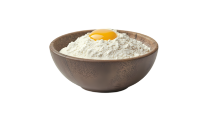 A wooden bowl filled with white flour and a single egg yolk sitting on top isolated on  isolated on transparent background