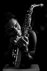 Black and white photo of a man playing the saxophone