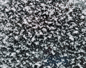 Fresh fallen white snow on glass.