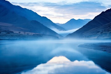 Serene mountain lake mist sunrise landscape