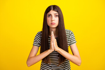 Photo of funny cute girl hold arms together pleading help desperate facial expression isolated...