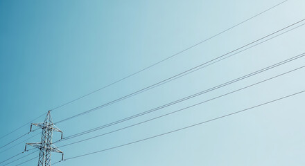 Power lines stretch across a clear sky during a sunny day in the countryside