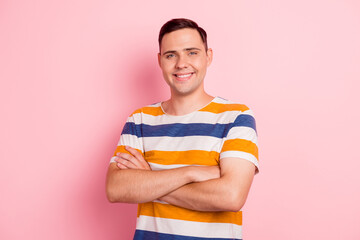 Portrait of his he nice attractive content cheerful guy folded arms isolated over pink color...
