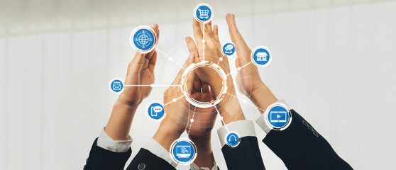 This dynamic image captures multiple hands celebrating collaboration, surrounded by digital...