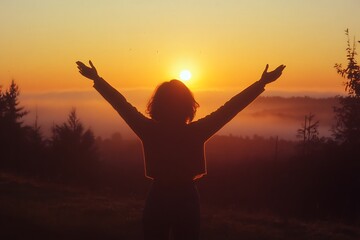 Fototapeta premium silhouette of a woman in sunset