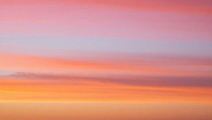 Obraz premium Beautiful sunset sky with colorful layers of pink orange and purple hues during golden hour