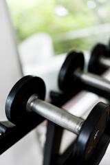Fototapeta premium Close up of metal dumbbells. Fitness gym training sport equipments concept.
