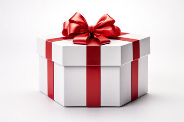 Obraz premium White gift box with red ribbon isolated on a white background