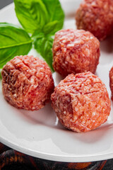 Meatballs raw meat pork, beef, chicken fresh delicious gourmet food background on the table rustic food top view copy space