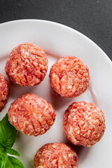 Meatballs raw meat pork, beef, chicken fresh delicious gourmet food background on the table rustic food top view copy space