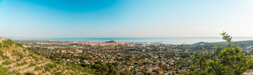 Panoramic view to Denia city and the Mediterranean sea in the morning.