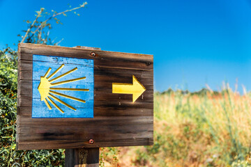 Wooden board with the Camino de Santiago signs on it