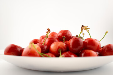 This delightful shot captures a generous pile of fresh, ripe cherries, evoking pure natural sweetness and seasonal joy. Perfect for food photography, healthy recipes, or farmers' market promotions