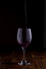 red wine pouring into glass