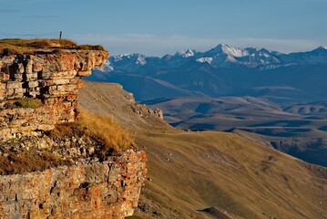 Russia, the Elbrus region. Stunning dawn view of the Caucasus mountains from the cliffs of the Bolshoy Bermamyt plateau.