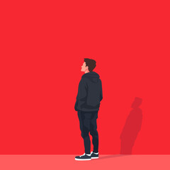 Young Man Standing Against Bold Red Background