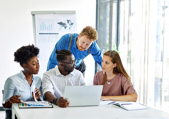 Group of young business people using laptop having a meeting or presentation and seminar in the office