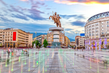 Square Macedonia in Skopje at sunset with dancing illuminated fountains and statue of Alexander the...