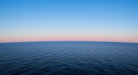 Obraz premium Serene Ocean Horizon at Sunset - Tranquil ocean scene at sunset, showcasing a calm sea meeting a pastel sky. Perfect for travel, nature, or peace themes