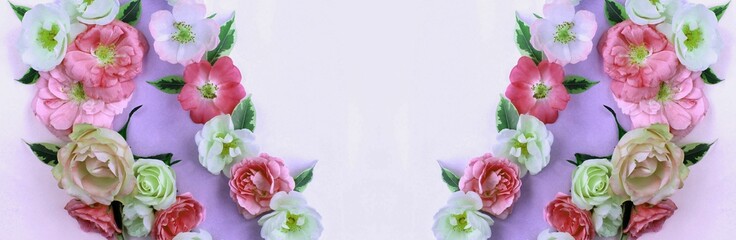 Multicolored roses on a light lilac background and a place for text. Background for congratulations.