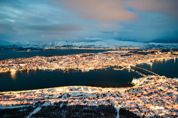 Dusk view with city lights of Tromso, Norway above arctic circle