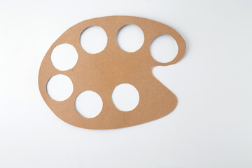 DIY kids project turning cardboard into painter palette, perfect for educational toy companies, green product brands, kids craft boxes, early art development resources,