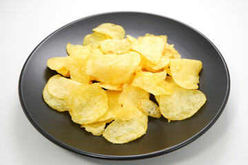 potato chips on food plate  isolated on white background