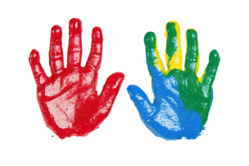 Two hands with colorful paint prints against a black background representing creativity and art