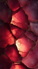 Abstract red gemstone surface texture, fractured with glowing golden lines and rich color