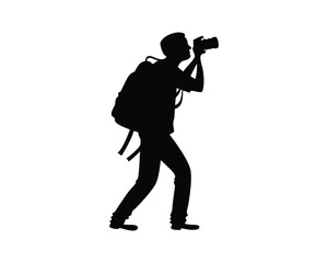 Silhouette of a Photographer with Backpack Taking a Photo