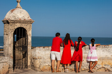 Young family of four traveling together. Family love concept. Travel concept. Cartagena de Indias.