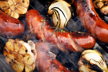 Grilled pork sausages on the grill, close up view
