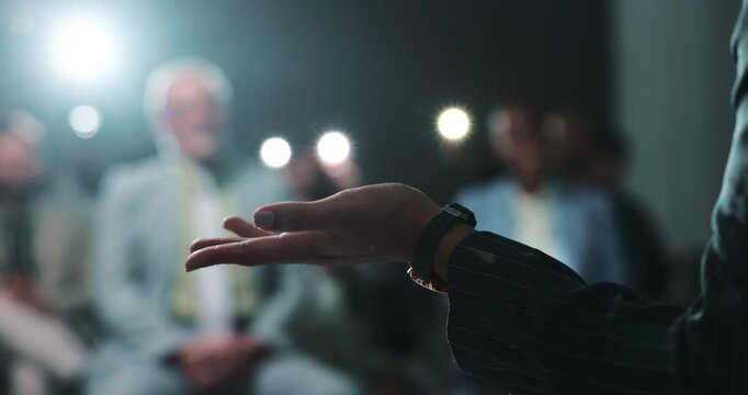 Presentation, hand and speaker with motivation for crowd, person or politician with speech on stage. Press conference, legislator and announcement for audience in official event, talking and podium