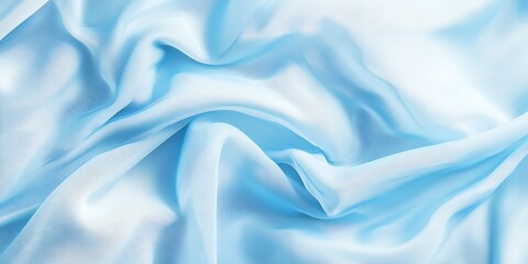 Obraz premium Draped light blue silk fabric texture background