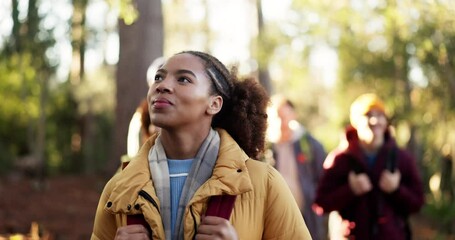 Hiking, woman and friends with walking in forest for travel adventure, explore nature and journey. Backpacker, wellness and group with backpack in woods for sightseeing, fresh air and outdoor scenery