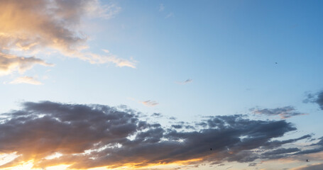 Beautiful bright sunset evening sky with dramatic clouds. Sunset background.