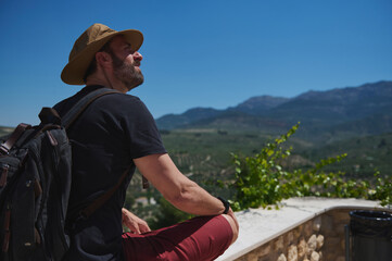 Traveler Enjoying the Scenic Landscape of a Mountainous Surrounding