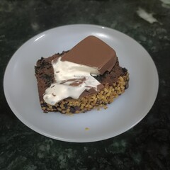 Decadent chocolate cake topped with creamy frosting and rich chocolate—an irresistible treat for dessert lovers.