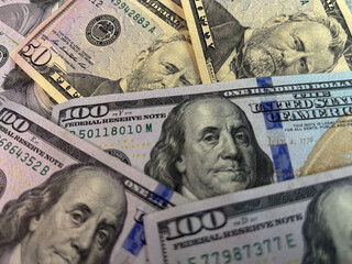 Scattered US dollar bills on a white background. Chaotic money spread representing finance, wealth, risk, cash flow or economic concepts