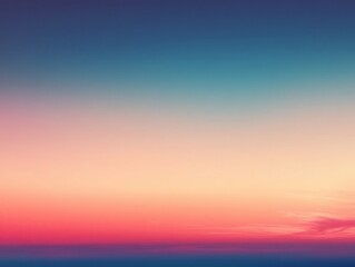 Fototapeta premium Gradient sunset over the horizon with a blend of blue, pink and orange hues