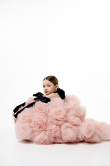 Young Girl in Fluffy Pink Dress with Black Accents