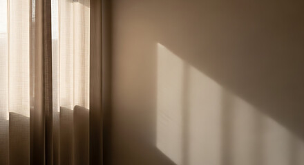 Sunlight filters through sheer curtains, casting gentle shadows on a warm wall. The soft ambiance creates a peaceful and inviting atmosphere in this relaxing space.