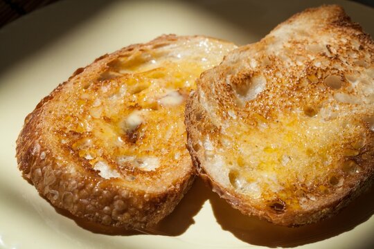 closeup of toasted sourdough slice of bred with butter