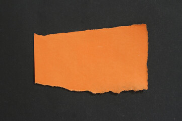 Torn rip paper texture on black background