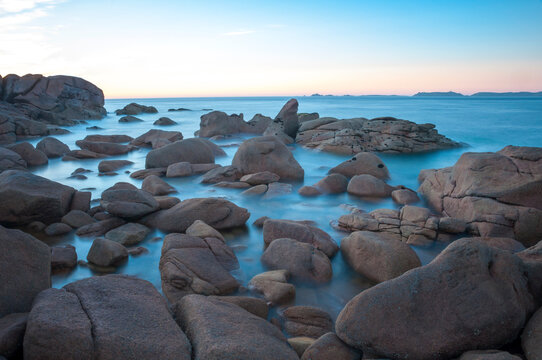 France,Bretagne.Pink granite rock formations at the coast  on a sunny summer evening