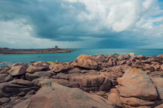 France,Bretagne.Pink granite rock formations at the coast  on a sunny summer evening