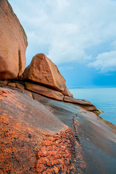 France,Bretagne.Pink granite rock formations at the coast  on a sunny summer evening