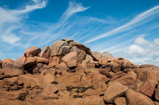 France,Bretagne.Pink granite rock formations at the coast  on a sunny summer evening