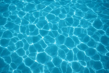 Obraz premium Sunlight reflections on clear blue water surface