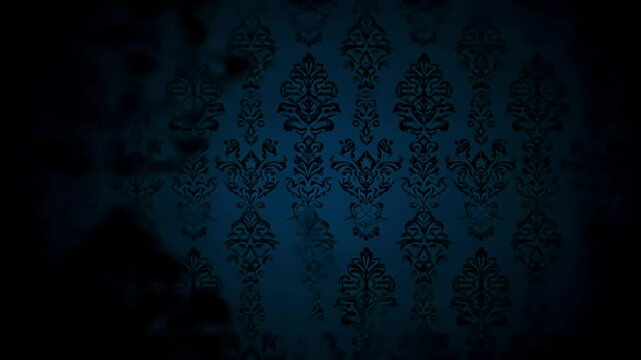 Dark, blurry image of an ornate, damask patterned wall